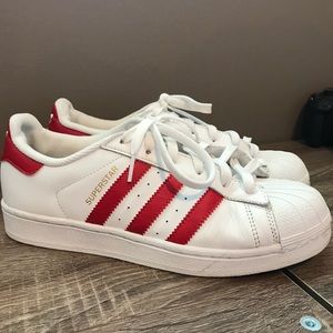 Red striped adidas shoes